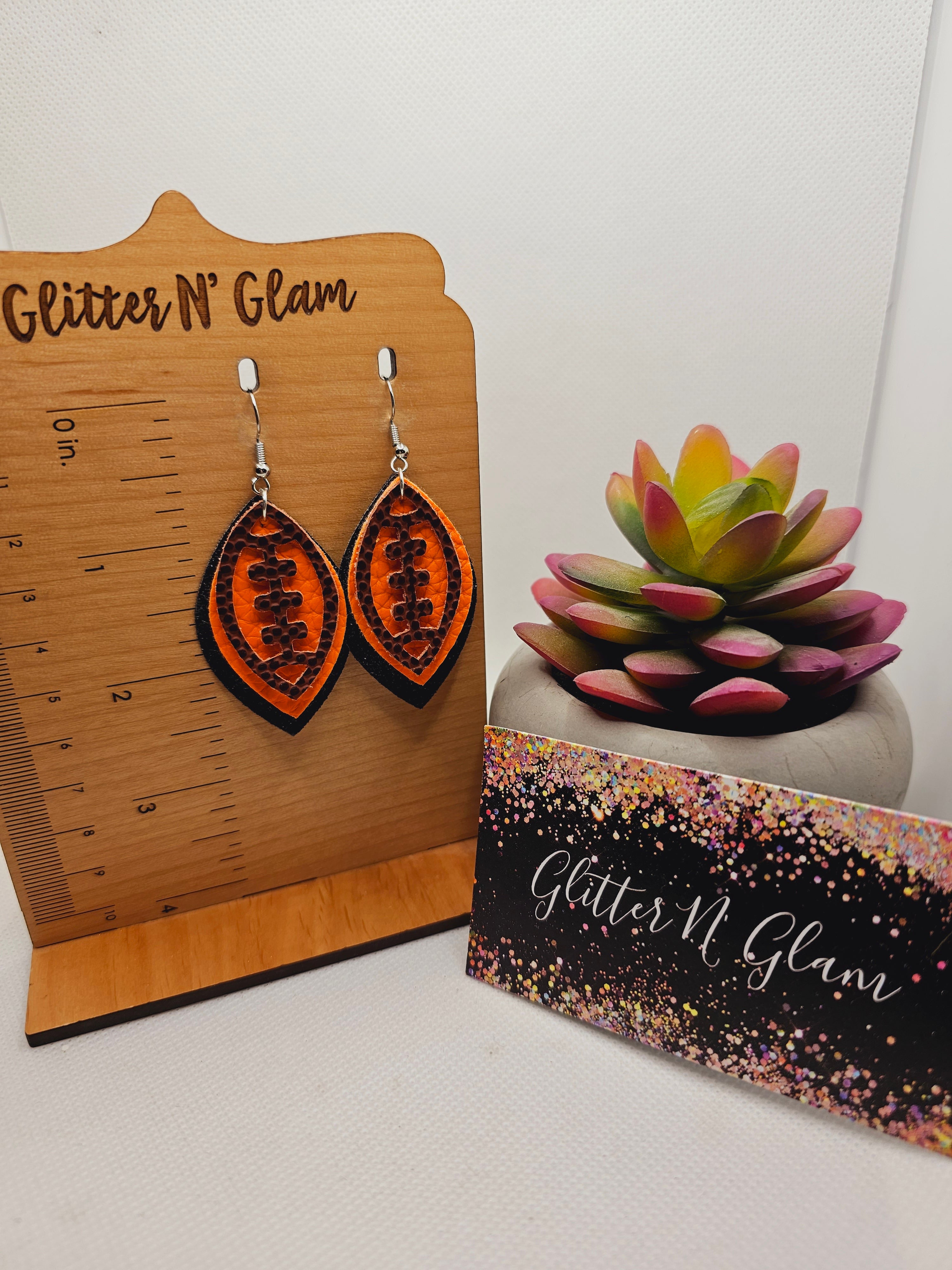 1947 Orange and Black Football Dangle Earrings