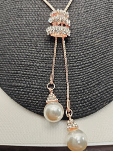 2011 Rosegold Long Sweater Necklace with Adjustable Bling and Pearls.